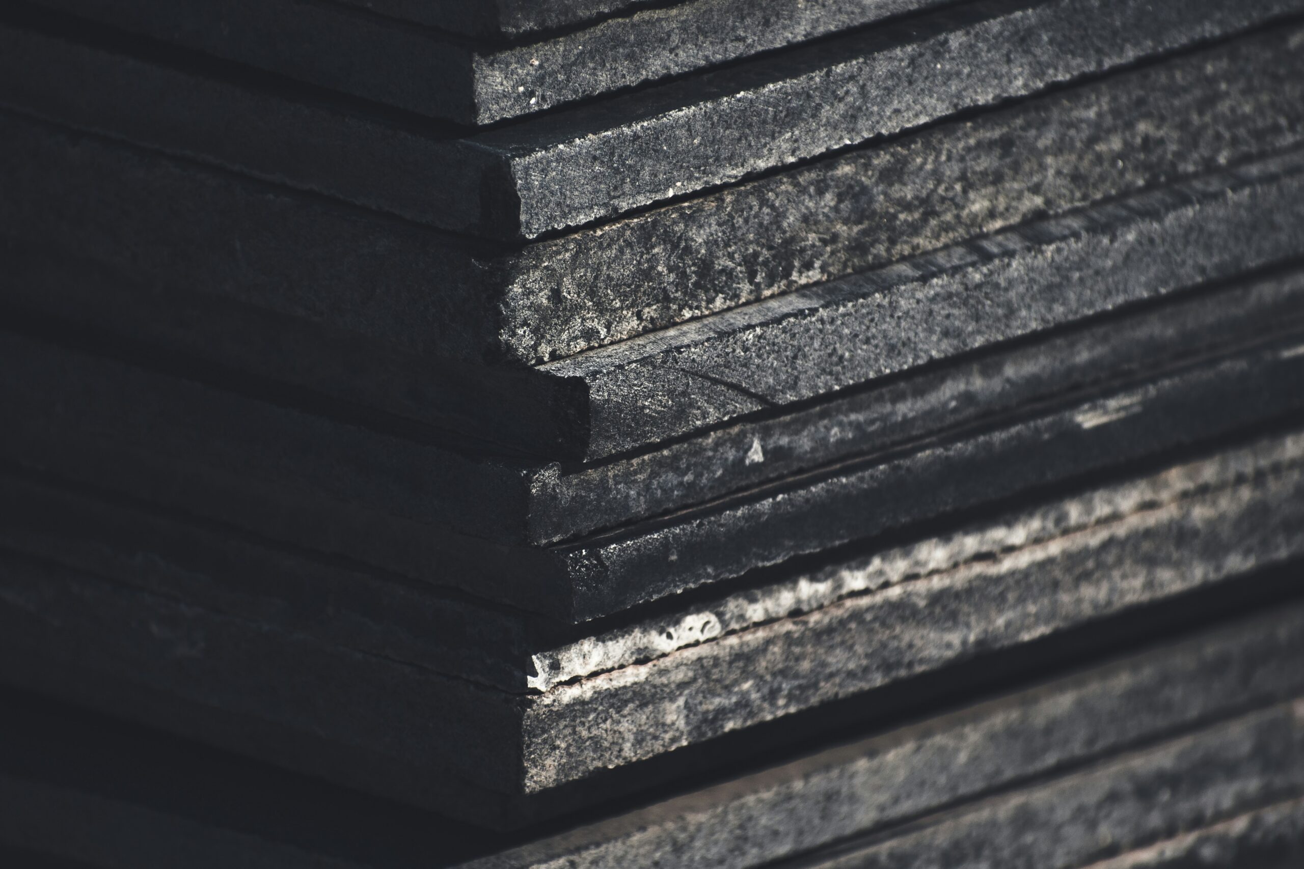 a stack of black boards stacked on top of each other